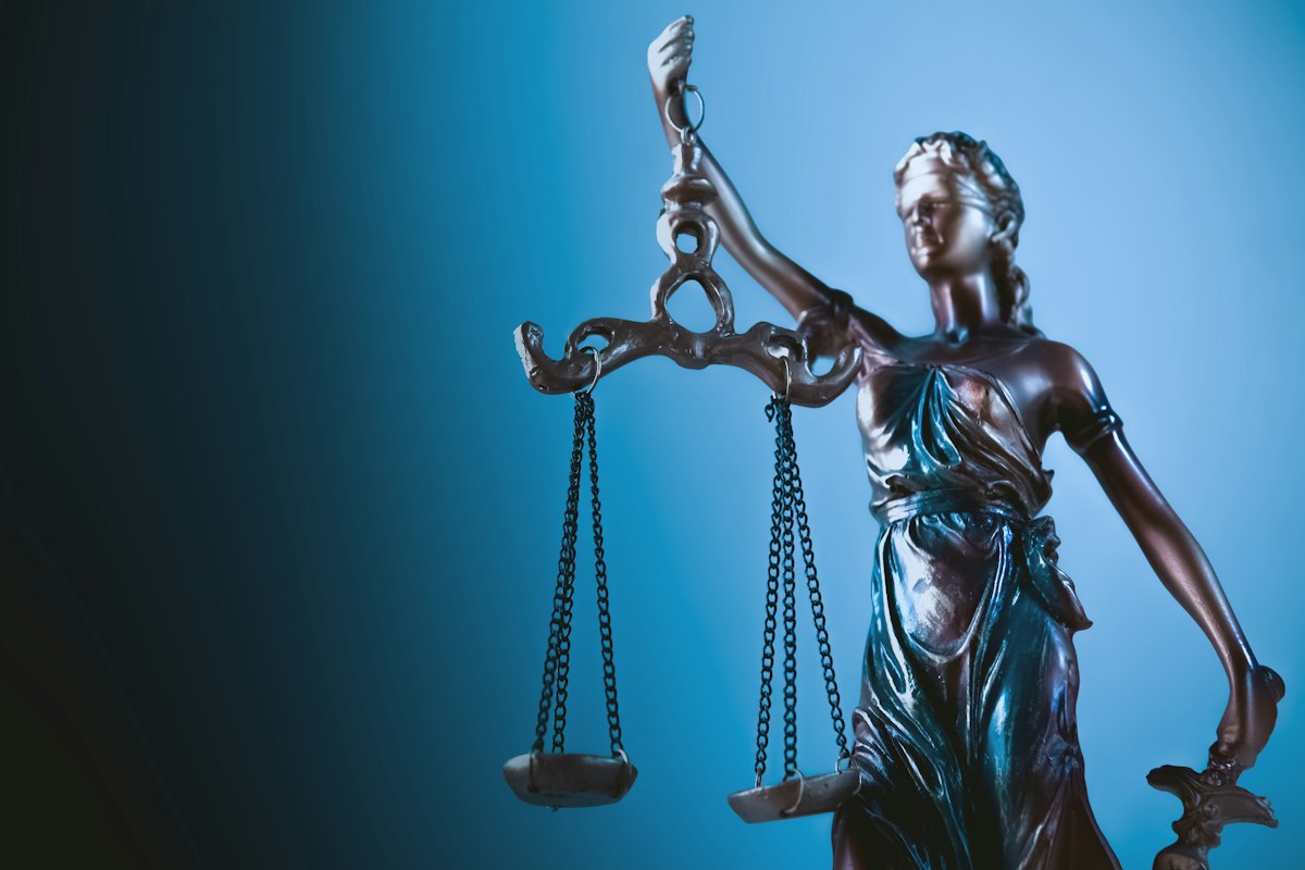 Statue of justice holding the scales