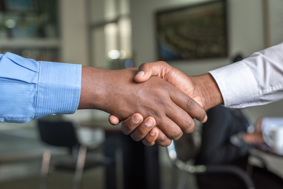 Handshake between a lawyer and a client, representing trust and partnership