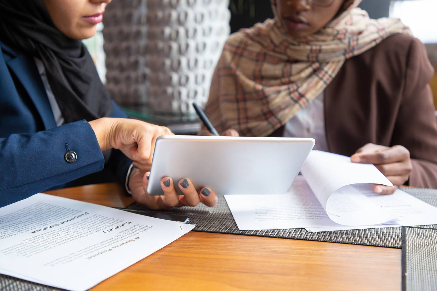 Close-up of hands reviewing a proposed legal solution document